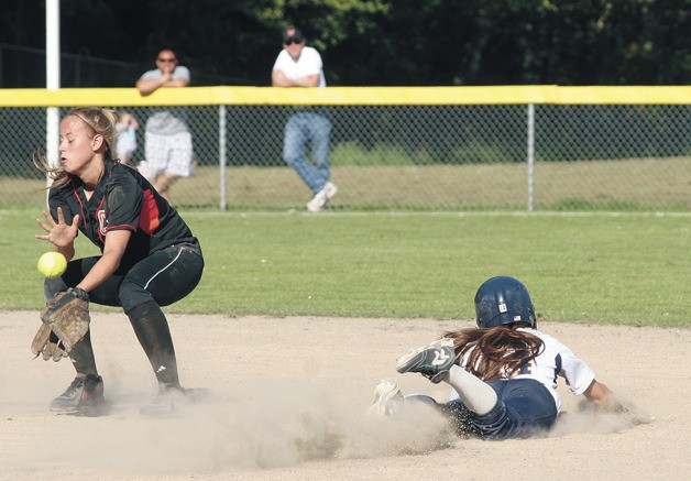 Riley Gregoire slides safely into second while a Central Kitsap player bobbles the catch during the Spartans’ 2-0 win.