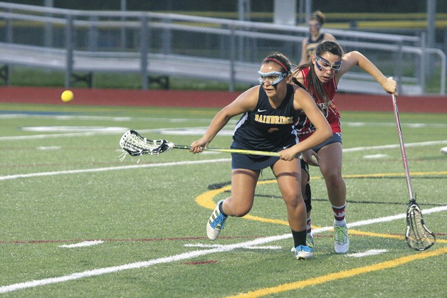 Sonia Olson chases down a ground ball for Bainbridge during the Spartans’ 18-1 win over Kennedy in the first round of the state lacrosse playoffs.