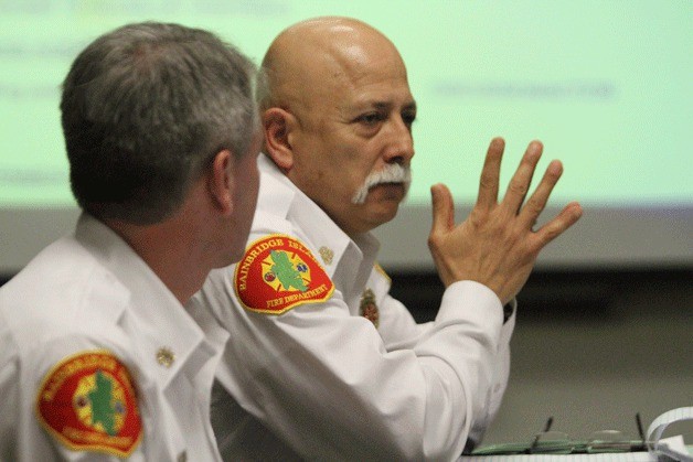 Fire Chief Hank Teran listens as the board of commissioners discuss staffing at Station 23 during the board meeting Monday.