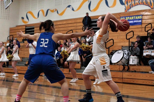 BHS senior post Kayla Buchmeier looks for a teammate to pass to early in the game.