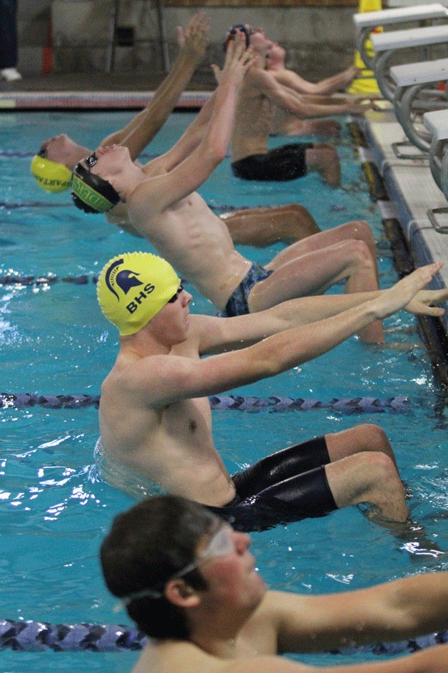 Swimmers launch at the start of the 200-yard medley relay during the meet against Roosevelt. The Spartans’ A Relay Team qualified for the state championships in the race.