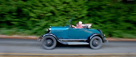 Robert and Margie Paulson take a drive along Manzanita Tuesday in their 1928 Ford Model A Roadster. Paulson bought the car in 1953 and courted his wife in it. They still use the roadster for day-to-day trips around the island.
