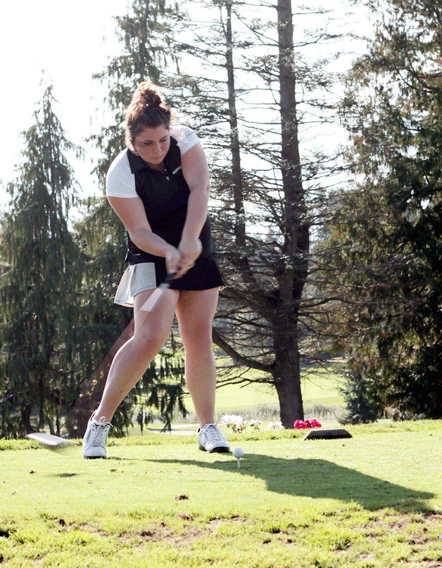 Spartan golfer Grace Nelson tees off at the first hole at Wing Point Golf Course Thursday