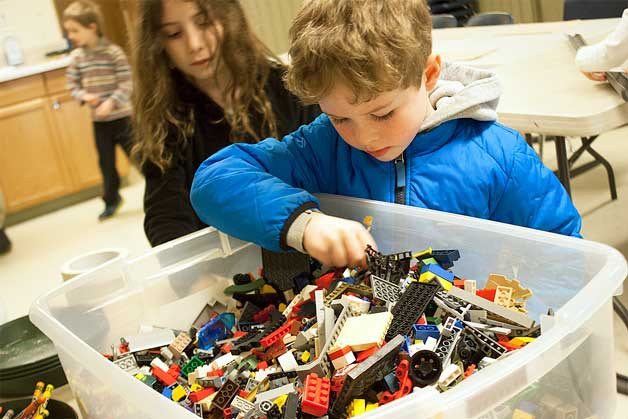 Lane Sturtevant searches for the perfect LEGO during free play time at Camp Yeomalt. Lane is one of several children participating in Bainbridge Island Metro Park & Recreation District after-school enrichment programs.