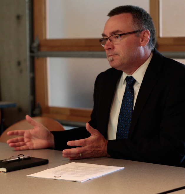 Bainbridge Island City Manager Doug Schulze talks to reporters at a press conference in October.
