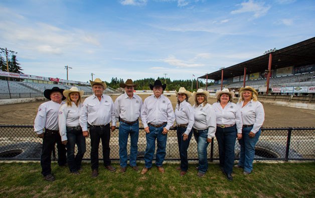 The Kitsap County Fair Board poses for its annual photograph near the Thunderbird Arena. All volunteers