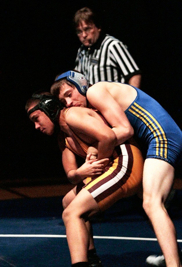 Spartan wrestler Chaney Weaver puts a hold on O'Dea's Markel Green in the 138-pound match Tuesday