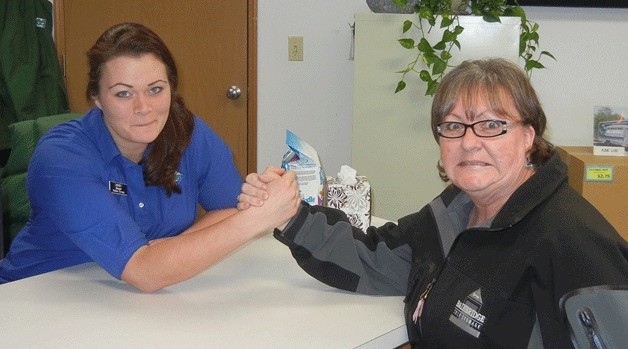 Reliable Storage manager Lindsay Watson and Bainbridge Storage assistant manager Isabelle Cobb are having another battle royal this year to see who can raise the most donations in a pet food drive for the Kitsap Humane Society.