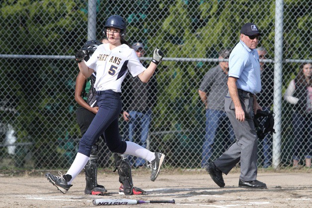 Another Bainbridge run crosses the plate during the Spartans' shellacking of Franklin in fastpitch softball.