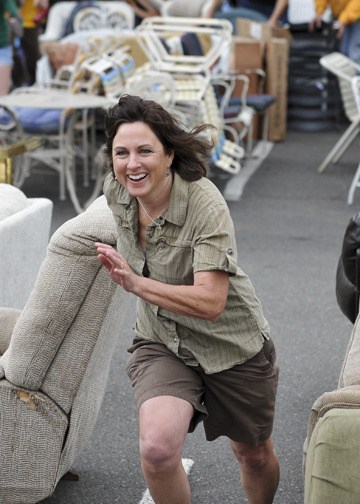 An enthusiastic 2010 Rotary Auction and Rummage Sale participant keeps her eye on the prize. Bainbridge Island hosts a cluster-fest of activities this weekend