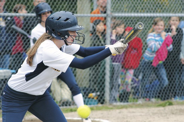 Kate Kinney tries to lay down a bunt in action against Holy Names Academy.