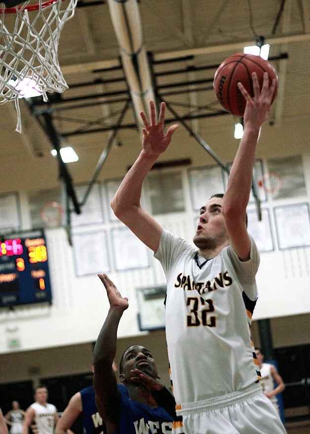 Bainbridge junior wing Ben Beatie jumps for a basket during the home game against West Seattle Saturday