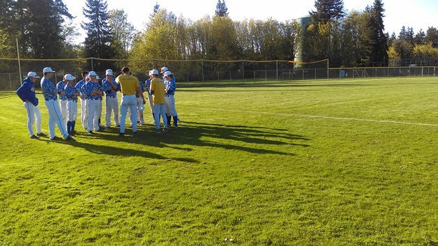 The Bainbridge varsity baseball team huddle up after last week’s 7-4 loss to Garfield High.