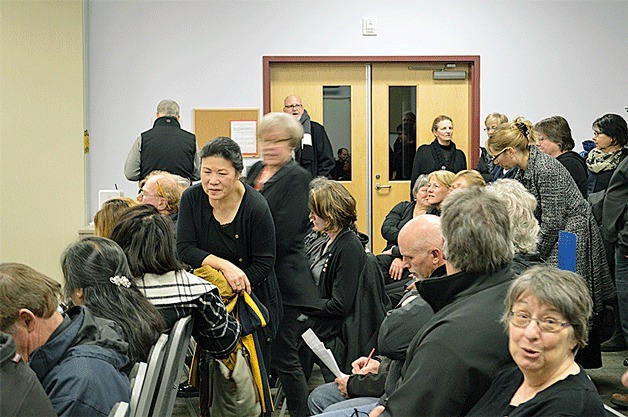 Classified staff fill the room during a recent school board meeting. They wore black to show solidarity with colleagues who voiced contract concerns.