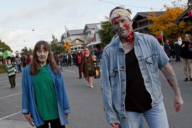 Two zombies make their way down Winslow Way during the Halloween festivities on Oct. 31.