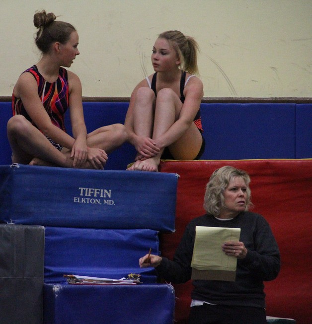 Spartan Coach Cindy Guy watches over a recent practice of the BHS gymnastics team.