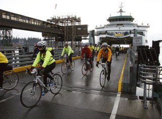Bicyclists roll off a morning ferry for the start of the 2009 Chilly Hilly ride.