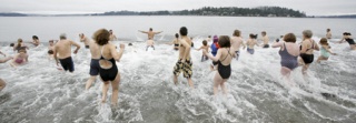 Islanders take a speedy dip into Rich Passage New Year's day.