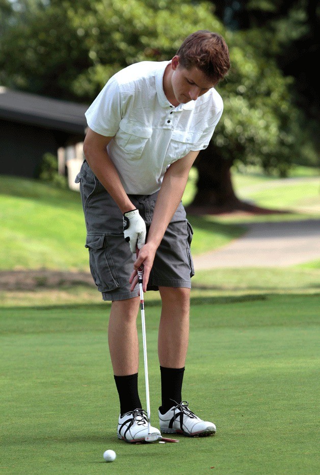 Returning BHS boys golf team member Nate Boegl works on his short game during a recent practice session. The team's season officially began Thursday with their first home match of the year.