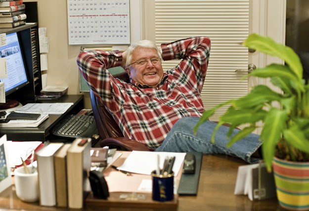 Bill Knobloch sits at the desk in his home office that has been the center of his work as a council member over the past ten years.