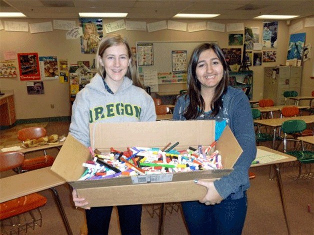 Woodward Earth Service Club members Erin Thackray and Bella Rana display their collection for the ColorCycle program.