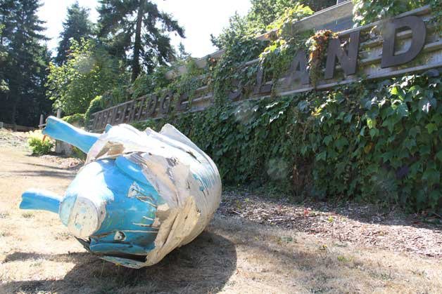 'The Pig in the Blanket' lies on its side after being toppled from the Bainbridge Island sign on north Bainbridge Monday morning. The pig
