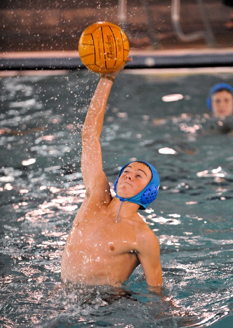 Ian Layton snatches the ball during water polo practice this week.