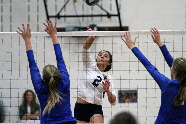 The Spartans’ Grace Hall elevates for a return against Seattle Prep during a spirited Metro matchup at home.