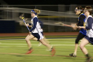 Bainbridge Spartans Lacrosse player Sally Baumgartner races to the goal during a home game last Thursday against the  Tacoma Tigers.  The Spartans defeated the Tigers 20-0.