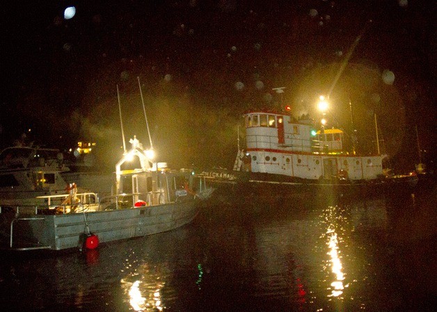 The 100-year-old wood tugboat 'Chickamauga' is towed from Eagle Harbor the morning of Jan. 31.