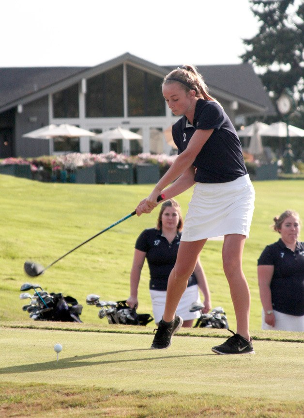 Bainbridge High School freshman golfer Kendall Havill tees off at the first hole at Wing Point Golf & Country Club during last week’s match against Ingraham High.