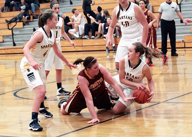 The struggle for ball control goes to the ground as BHS junior post Kayla Buchmeier fends off a Kingston player.