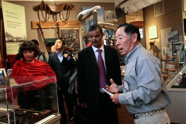 Gary Sakuma leads the visiting group of International Cultural Heritage Preservation participants through the Bainbridge Island Historical Museum Wednesday