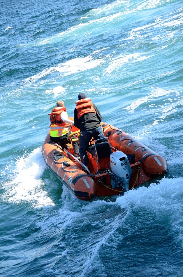 An inflatable raft from the ferry M/V Wenatchee sets out to search for an overboard passenger.