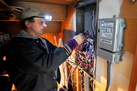 Greg Smith of Bainbridge Island Electric works on wiring  the direct control unit