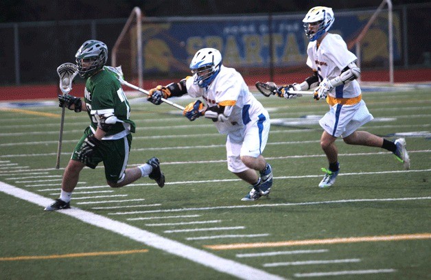 A pair of Spartans chase down a Skyline player during Bainbridge's narrow win over their namesakes from Sammamish.