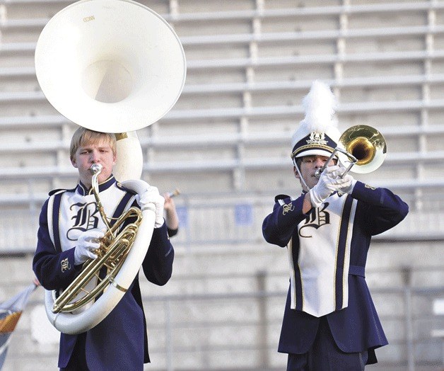 Ryan Abbott on tuba and Eric Powell on trombone perform at the Auburn Veterans’ Day Parade and Marching Band Competition on Saturday