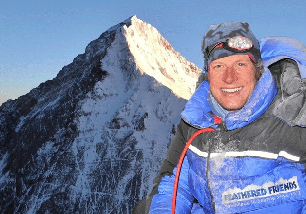 With Mount Everest behind him