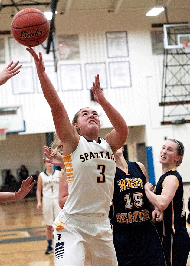 Spartan sophomore wing Katie Usellis fights for a rebound during the home game against West Seattle.