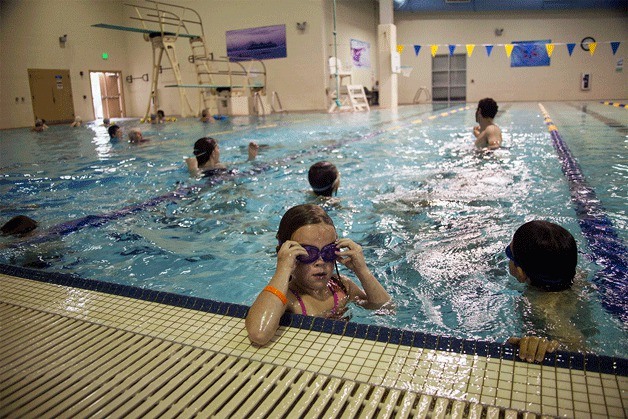 One young swimmer takes a break during the lesson.
