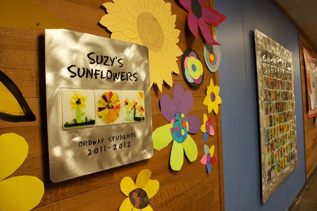 The mural memorializing third grade teacher Suzy Peters now hangs on the wall outside the office at Ordway Elementary.