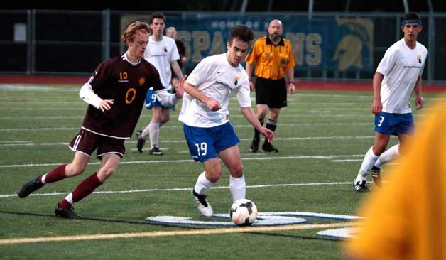 Anton Easterbrook drives the ball through O'Dea's defensive efforts during last Thursday's game.