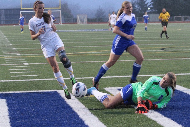 Riley Gregoire beats the Bulldog goalkeeper again with a kick while she’s down. Gregoire scored three times against Garfield in this week’s Metro matchup.