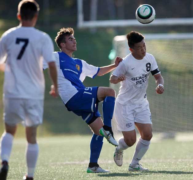 Glacier Peak’s Kevin Duan heads the ball upfield during last week’s first round of state playoffs. BHS was bested 2-0.