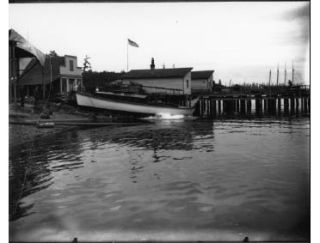 ZINA slides into  Eagle Harbor for the beginning of its maiden voyage in 1908.