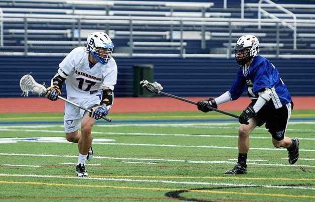 Greg Shea sets up a score for the Spartans during the team’s opening round win against Bothell-Northshore in the state boys lacrosse playoffs.