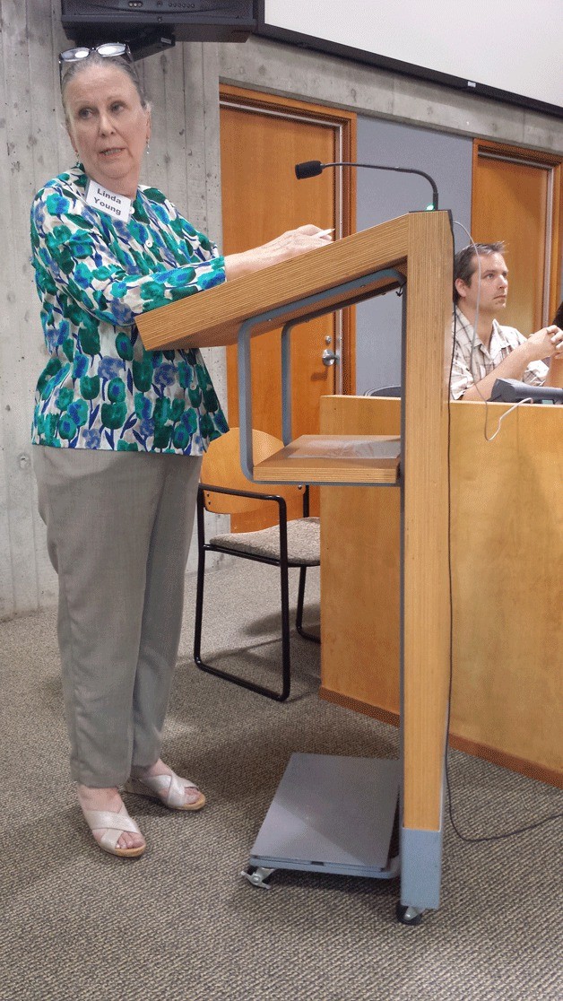 Shoreline property owner Linda Young speaks against the SMP update during Monday’s public hearing.