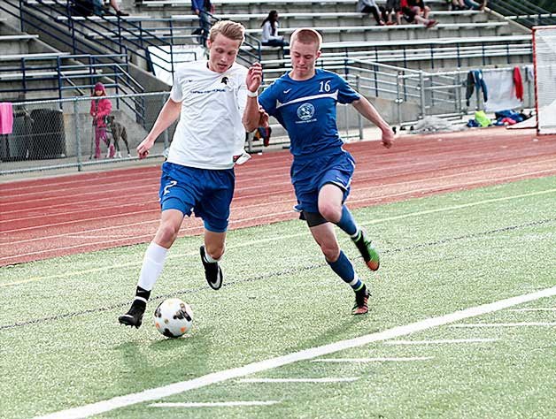 Spartan senior Gerrit Mahling takes a run at the Prep goal in action against the Panthers.