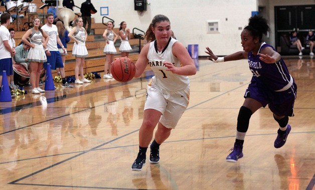 Bainbridge junior wing Katie Usellis moves towards the hoop during Friday’s game. The Spartans were bested 78-52