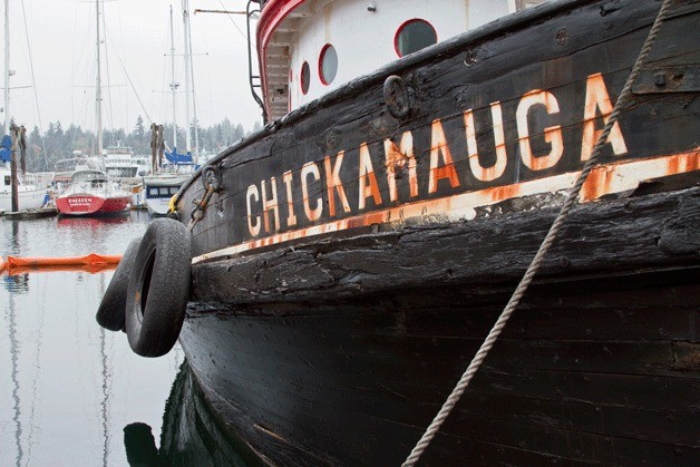 The historic tugboat 'Chickamauga' sits in its slip at Eagle Harbor Marina after having been raised by a Coast Guard contract company following its sinking early on Oct. 2. The boat is expected to remain at the marina until legal issues arising from the boat's absent owner are resolved and allow for its removal.